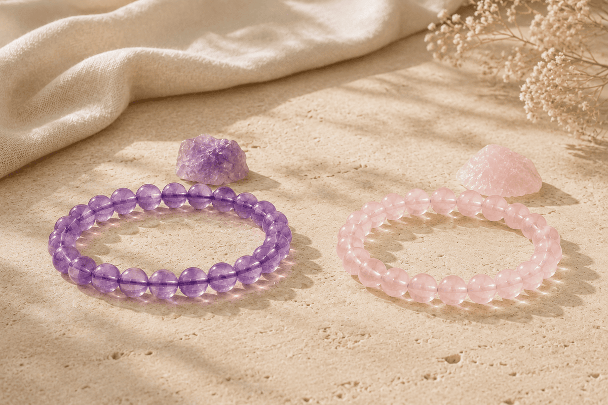 Amethyst and rose quartz bracelets displayed with matching raw stones for a side-by-side color comparison