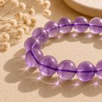 Close-up of an amethyst crystal bracelet with large polished purple beads