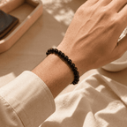 Black obsidian bracelet for men worn on the wrist with small polished round beads