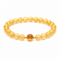 Citrine Bracelet with golden rutilated crystal beads, an elegant crystal bracelet for women on a white background