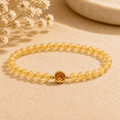 Golden rutilated quartz bracelet with small round beads and a gold-tone S925 star charm for women