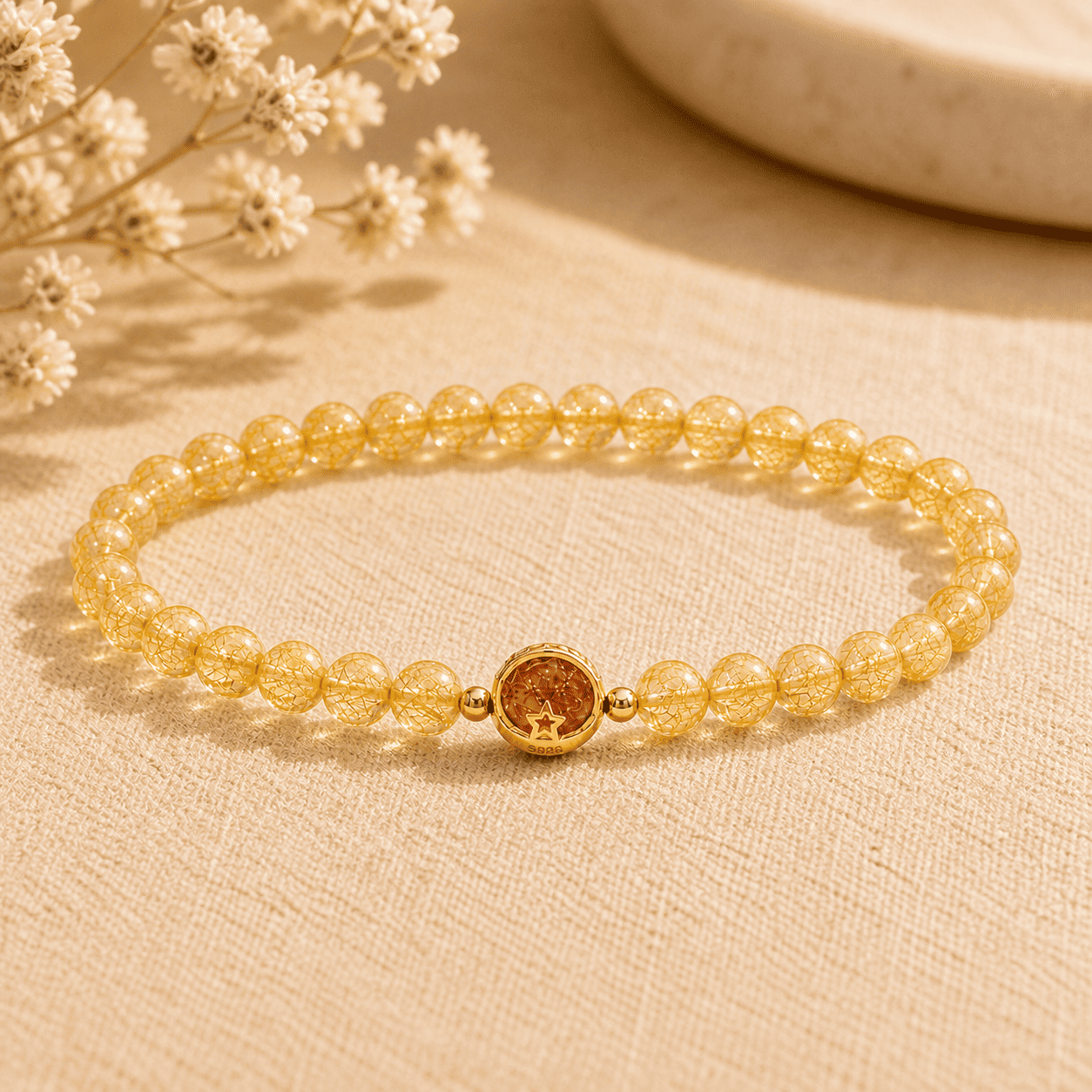 Golden rutilated quartz bracelet with small round beads and a gold-tone S925 star charm for women