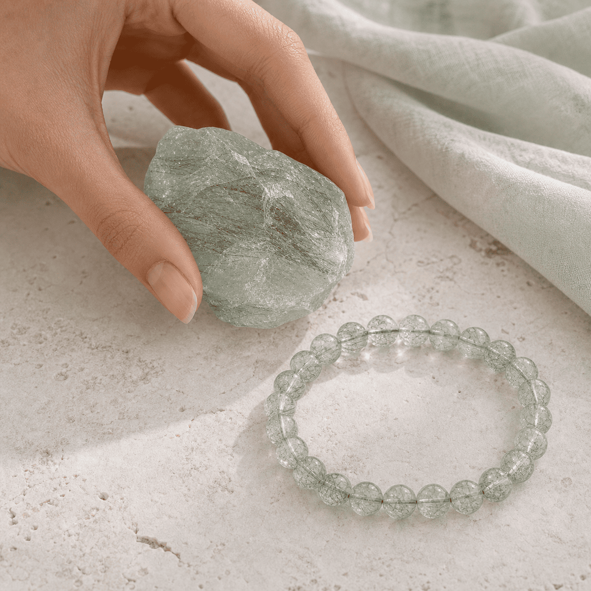 Green real crystal bracelet with matching raw natural crystal stone, shown in a clean close-up product scene