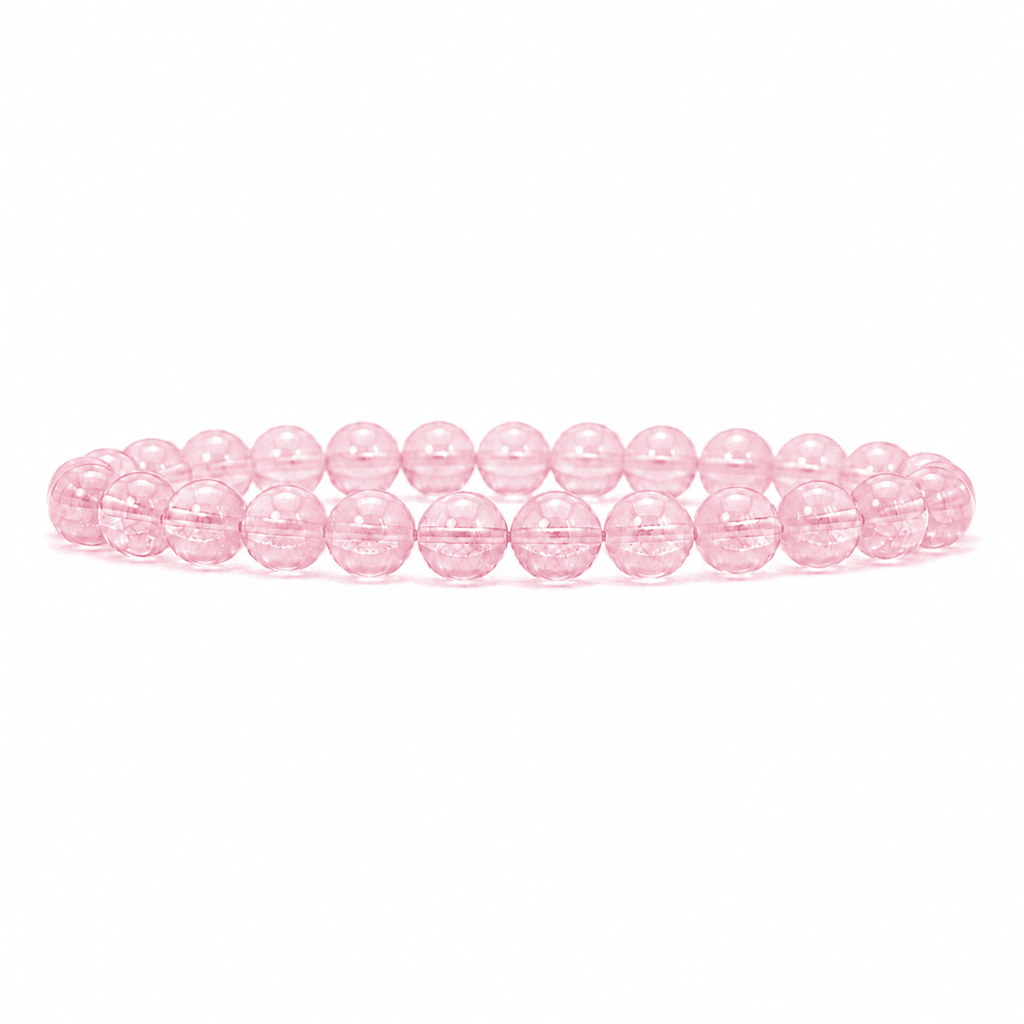 Rose quartz bracelet with translucent pink round beads displayed on a clean white background
